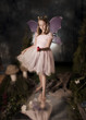 Photo: little girl dressed as fairy holding red bird little girl dressed as fairy holding red bird