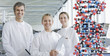 Scientists with molecular model in lab