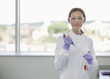 Scientists putting liquid in test tube in lab