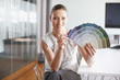 Businesswoman with paint swatches in office