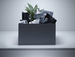 Box packed with desk objects