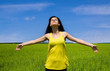 Happy woman enjoy sun in the field