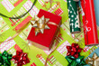 Wrapping paper, bows, and a red box Wrapping paper, bows, and a red box