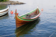 The wooden rowing and sailing boat The wooden rowing and sailing boat