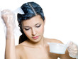 Woman dyeing brown hairs