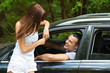 young handsome man sitting car talking woman