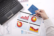hand specifies the financial chart, a workplace