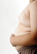 Fat boy, hand on stomach