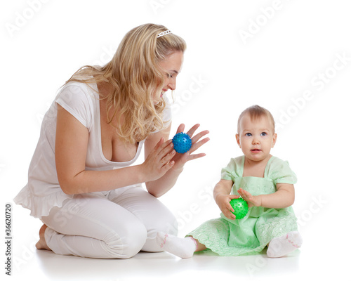 Photo: mother and her child massage with rubber devices mother and her child massage with rubber devices