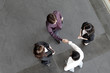 High angle view of Asian Business people shaking hands.