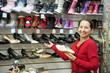 Mature woman chooses shoes