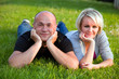 Adult happy couple together on grass Adult happy couple together on grass