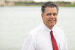 Photo: Handsome businessman by the water Handsome businessman by the water