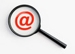 magnifying glass with @-symbol