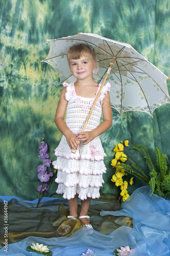 Photo: pretty girl with an openwork knitted dress umbrella pretty girl with an openwork knitted dress umbrella