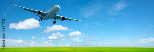 Photo: Jet airplane in a sky. Panoramic composition in high resolution. Jet airplane in a sky. Panoramic composition in high resolution.