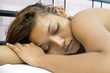 Young beautiful woman sleeping in bed