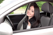 Photo: young brunette woman in new car young brunette woman in new car