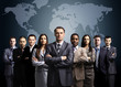 Businessmen standing in front of an earth map