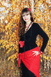 Young girl over autumnal background