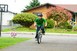 active young boy riding a bike