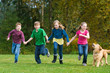 Group of kids running in a field