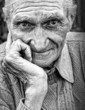 Old senior man with wrinkled face
