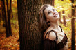 Foto: Happy pensive young woman in nature Happy pensive young woman in nature