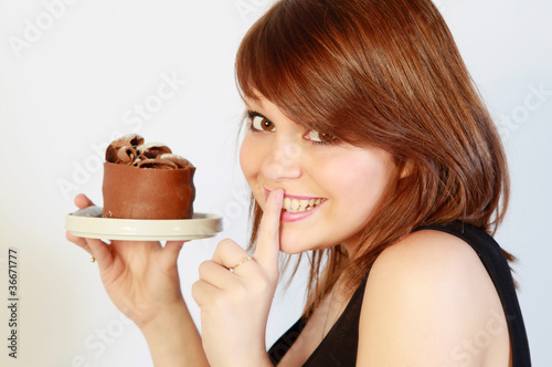 Photo: Jeune femme gourmande Jeune femme gourmande