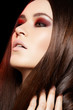 Woman model with shiny long hair, evening make-up
