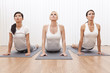 Photo: Interracial Group of Three Beautiful Women In Yoga Position Interracial Group of Three Beautiful Women In Yoga Position