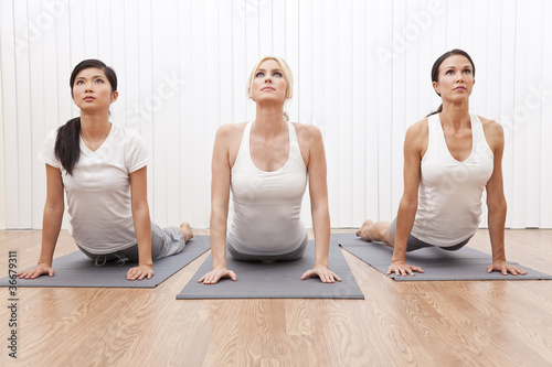Photo: Interracial Group of Three Beautiful Women In Yoga Position Interracial Group of Three Beautiful Women In Yoga Position