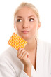 Woman with blister of tablets
