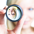 woman showing the principle of imaging through a lens