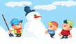 Kids building a snowman in the snow
