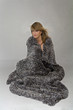 Pretty woman with real fur blanket