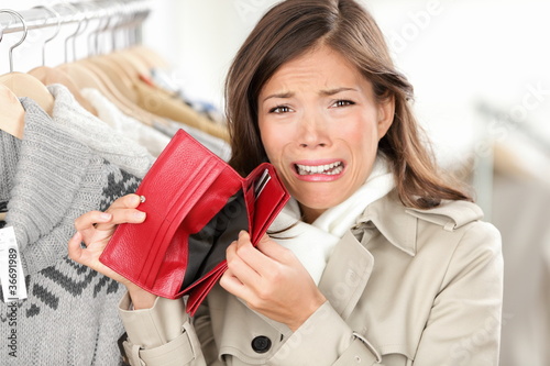 Photo: empty wallet - woman with no money shopping empty wallet - woman with no money shopping