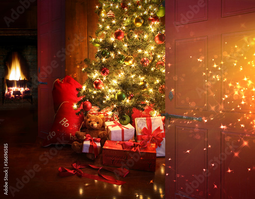 Photo: Christmas scene with tree and fire in background Christmas scene with tree and fire in background