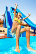 Child on water slide at aquapark.