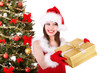 Girl in santa hat giving  gift box.