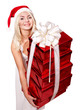 Christmas girl in santa hat holding stack gift box.