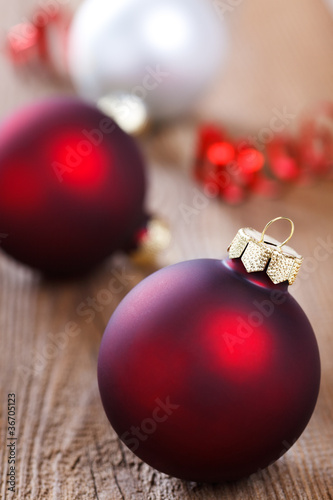 Photo: christmas baubles on wooden board christmas baubles on wooden board
