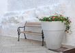 Giant white flowerpot with red geraniums, Italy Giant white flowerpot with red geraniums, Italy