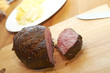 Sliced roastbeef on wooden plank