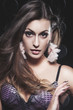 Portrait of a charming sexy brunette on dark background Portrait of a charming sexy brunette on dark background