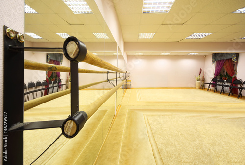 Photo: Empty light ballet class with ballet lathe and thick carpet Empty light ballet class with ballet lathe and thick carpet