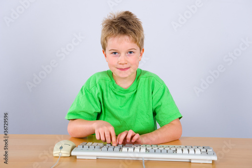 Photo: boy is surfing the web boy is surfing the web