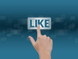 Hand pressing Like button