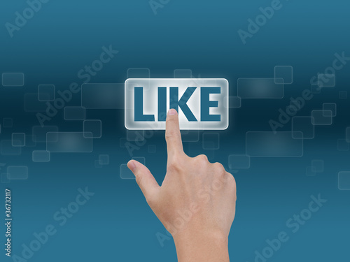 Foto: Hand pressing Like button Hand pressing Like button
