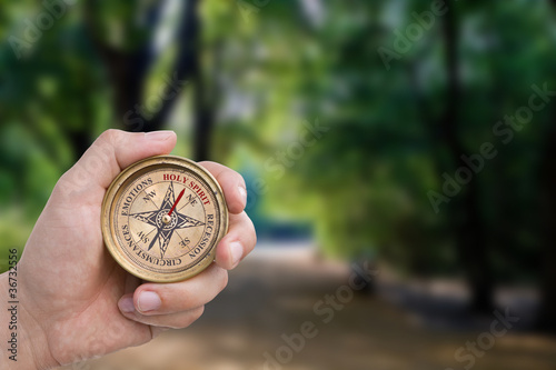 Photo: Male Hand Holding Christian Compass Male Hand Holding Christian Compass